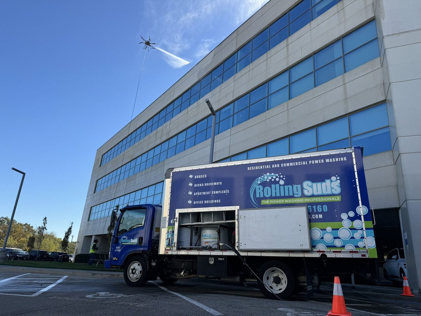 Rolling Suds drone washing an office building